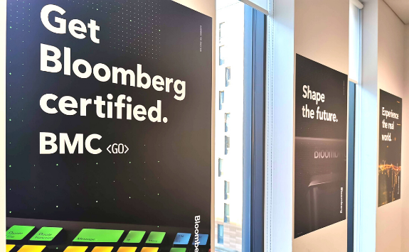 Man sitting at his desk using a Bloomberg Terminal